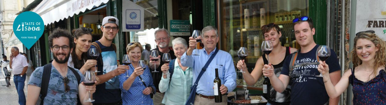 a group of people holding wine glasses