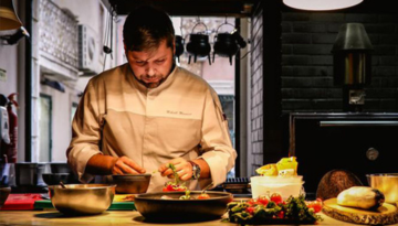 a man preparing food on a table