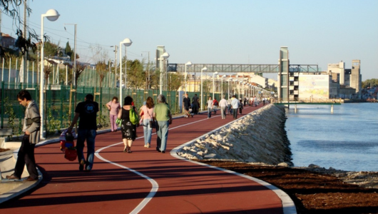 a group of people walking on a bridge