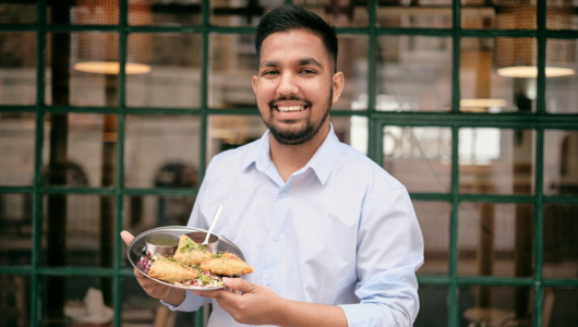 a man holding a plate of food