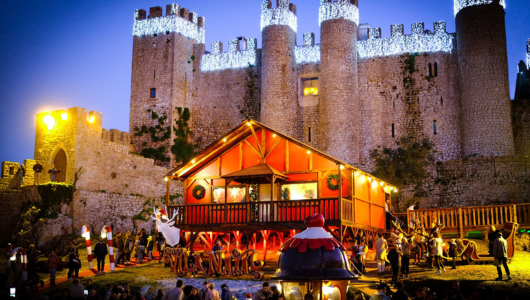 a group of people standing in front of a castle