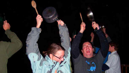 a group of people holding wine glasses