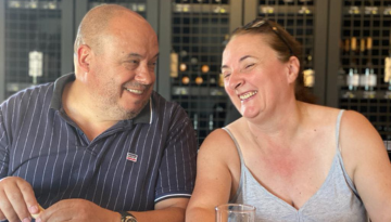 a man and a woman sitting at a table