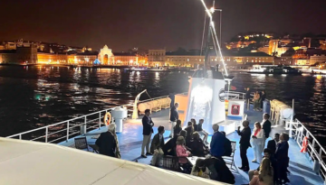 a group of people on a boat in the water