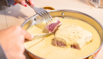 a piece of cake on a plate with a fork and knife