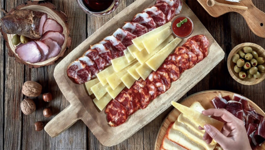 a hot dog on a wooden cutting board