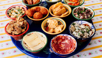 a bowl filled with different types of food on a table