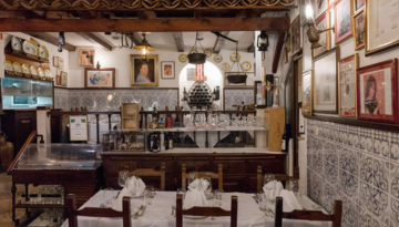 a kitchen with a table in a restaurant