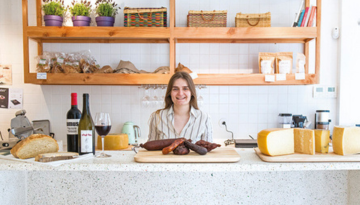 a person sitting on a kitchen counter