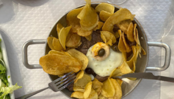 a plate of food with a fork and knife